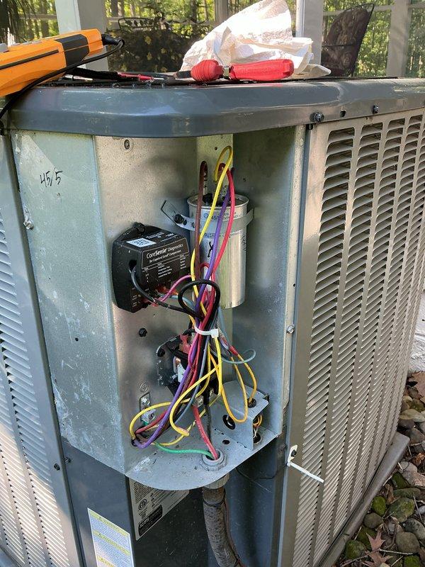Completed scheduled cooling system preventive maintenance on residential HVAC system. Performed comprehensive inspection of indoor air handler unit and outdoor condensing unit, including visual examination of all major components, electrical connections, and safety labels. Accessed outdoor unit electrical compartment to inspect capacitor, contactor, and control wiring for proper connections and signs of wear. All electrical components found to be in good working condition with secure wire terminations. Verified unit specifications and manufacturer information. System operating within normal parameters with no deficiencies noted at time of service.
