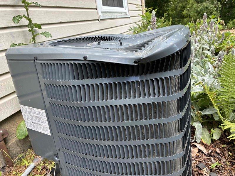 Performed routine preventive maintenance on residential air conditioning system. Inspected outdoor condenser unit, verified proper operation of fan motor and compressor, checked refrigerant lines and electrical connections for secure mounting and proper insulation. Unit found in good operating condition with adequate airflow through heat exchange coils and no visible signs of damage or system degradation.