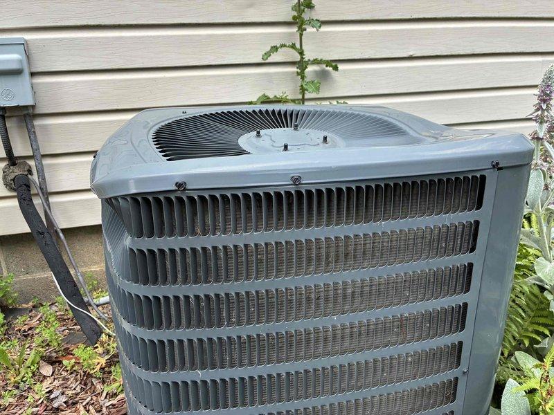 Performed routine preventive maintenance on residential air conditioning system. Inspected outdoor condenser unit, verified proper operation of fan motor and compressor, checked refrigerant lines and electrical connections for secure mounting and proper insulation. Unit found in good operating condition with adequate airflow through heat exchange coils and no visible signs of damage or system degradation.