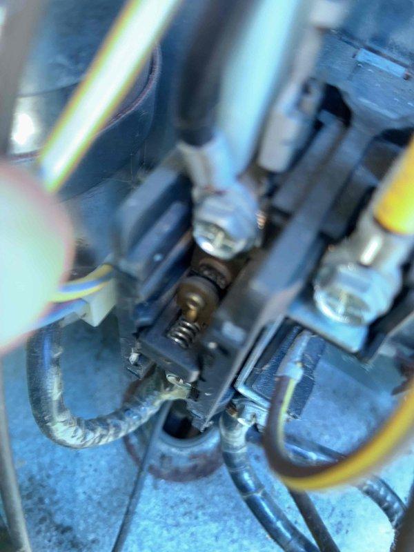# HVAC Cooling Maintenance Summary

Completed scheduled preventive maintenance on residential cooling system. Inspection revealed a heavily corroded capacitor with extensive rust and oxidation on the terminal plate and connections. Documented the deteriorated electrical component condition with multiple wire connections (blue, red, and yellow leads) showing signs of environmental exposure and age-related degradation. Verified all electrical connections and terminal blocks within the unit. System evaluated for proper operation and safety concerns related to the corroded components.

# Detailed Service Report

Performed comprehensive cooling system maintenance as part of ongoing preventive maintenance program. Upon inspection of the outdoor condensing unit, discovered significant corrosion on the run capacitor assembly. The capacitor's metal top plate exhibited extensive rust and oxidation, with three terminal posts showing advanced deterioration. The blade-style connectors attached to t