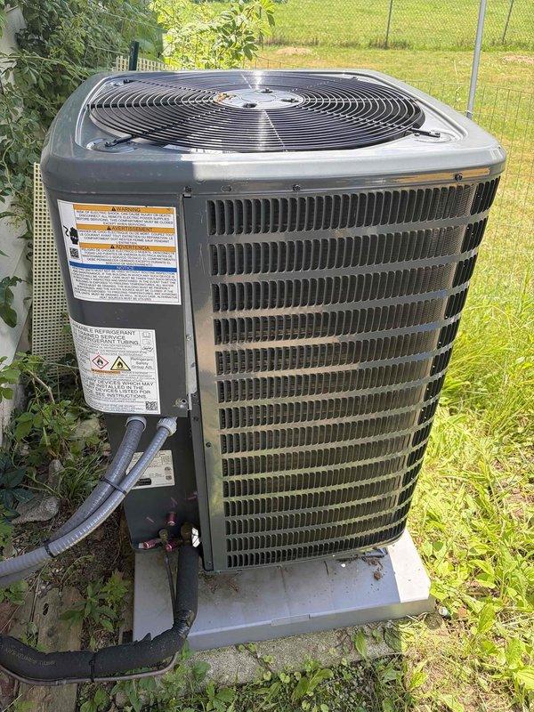 Completed scheduled preventative maintenance on residential cooling system. Performed comprehensive inspection of outdoor condenser unit, verified proper electrical operation using digital clamp meter with readings of 0.54A and 0.169A on system components, confirmed capacitor function, and documented equipment condition with no immediate repairs required.