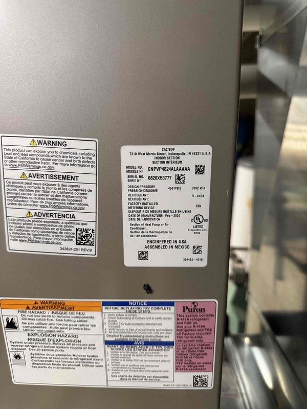 Performed site evaluation and requote for evaporator coil replacement on main residential system covered under parts warranty. Documented unit specifications and operating temperatures, measuring supply air temperature at 55°F. Inspected Carrier model CNPVP4824AL4N135 air handler unit, verified serial number and technical specifications for proper parts ordering and warranty claim processing.
