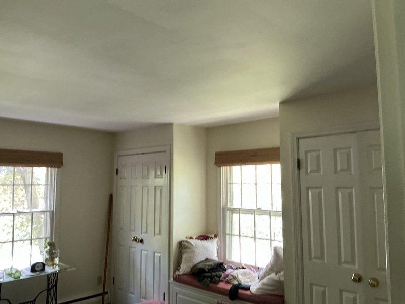 Conducted on-site evaluation for mini split system installation in a 3,200 square foot residential property. Assessed multiple interior spaces including upper-level bedroom with angled ceiling architecture and main living areas to determine optimal placement for indoor air handling units. Documented existing room configurations, ceiling heights, wall construction, and architectural features to develop comprehensive equipment sizing and zone layout recommendations for whole-home comfort solution.