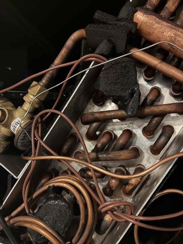 Returned to site to complete warranty leak search on HVAC system. Inspected refrigerant lines, connections, and mechanical components for potential leak sources. Documented equipment condition and connection points with photos for warranty records.