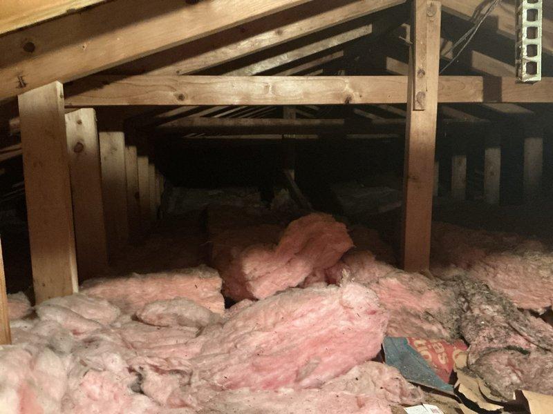 Conducted site assessment for mini split AC installation to supplement existing boiler heating system. Evaluated attic space accessibility, structural framing, and insulation conditions to determine optimal placement for indoor air handler unit and refrigerant line routing. Documented existing HVAC infrastructure including flexible ductwork and available mounting locations for equipment installation.