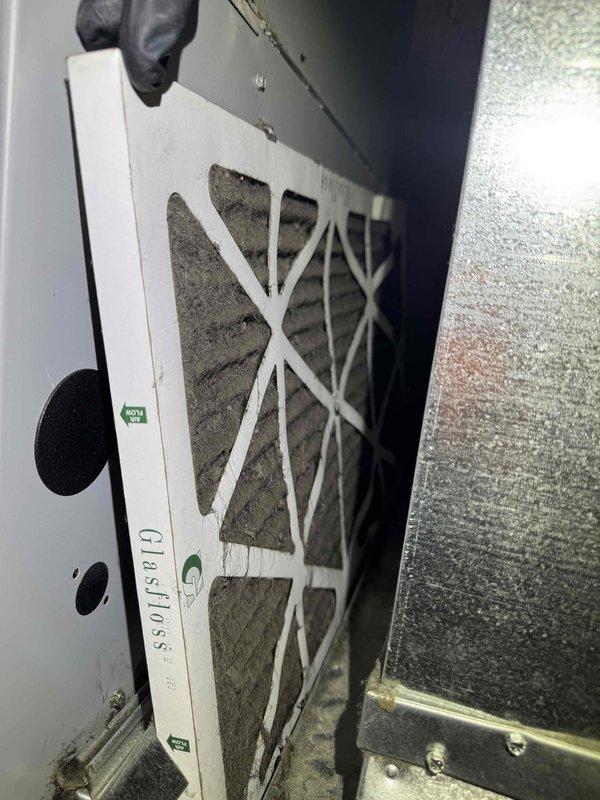 Completed comprehensive furnace tune-up service on residential HVAC system. Inspected and serviced air filter within the air handling unit, verified proper installation and assessed filter condition showing normal dust accumulation. Performed standard maintenance procedures on furnace equipment located in basement mechanical room, ensuring all components operating within manufacturer specifications.