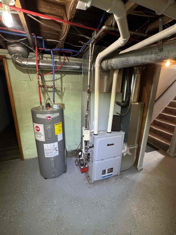 Completed comprehensive furnace tune-up service on residential HVAC system. Inspected and serviced air filter within the air handling unit, verified proper installation and assessed filter condition showing normal dust accumulation. Performed standard maintenance procedures on furnace equipment located in basement mechanical room, ensuring all components operating within manufacturer specifications.