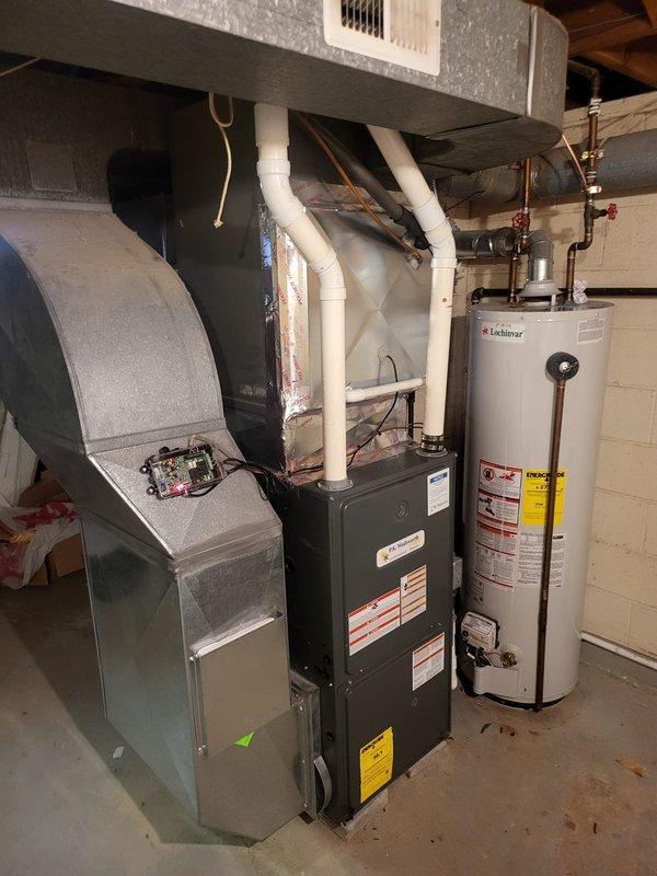 # HVAC Installation Summary

Completed full air conditioning system installation at residential property. Installed new Goodman brand outdoor condenser unit on concrete pad adjacent to brick exterior wall. Ran refrigerant lines through brick wall with proper insulation and connected to existing indoor air handler system. Verified all electrical connections, tested system operation, and confirmed proper refrigerant charge levels. Unit positioned on level pad with adequate clearance for airflow and future service access.

# Detailed Work Performed

Installed complete air conditioning system including outdoor condensing unit and associated refrigerant piping. Positioned Goodman brand condenser on existing concrete pad next to building foundation, ensuring level placement and proper drainage. Drilled penetration through brick wall for refrigerant line set routing.

Installed copper refrigerant lines with insulation wrapping from outdoor condenser through wall penetration to indoor air hand