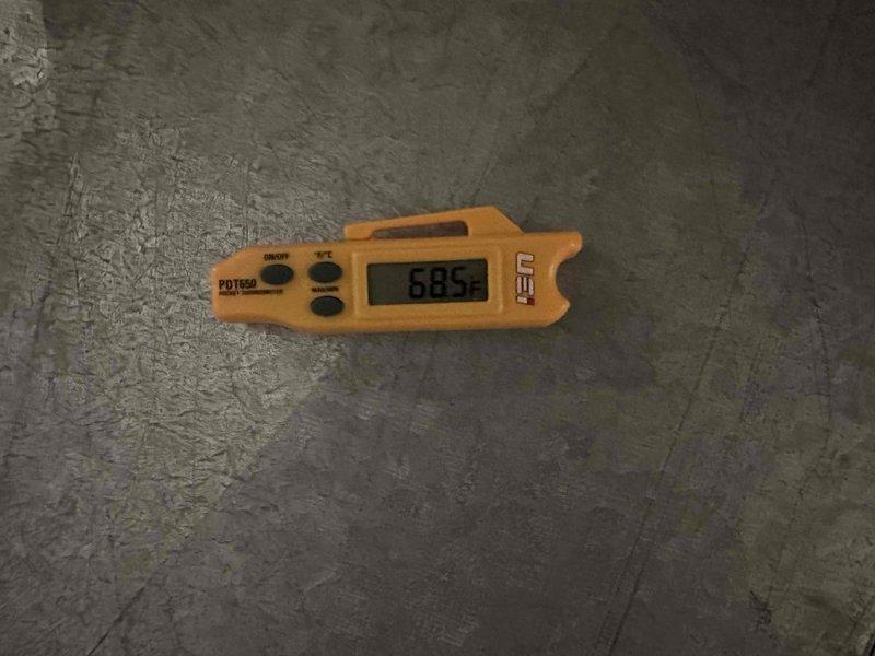 Completed scheduled HVAC cooling maintenance inspection and system evaluation. Performed temperature diagnostics using infrared thermometer, recording ambient readings of 68.5°F. Inspected electrical connections, terminals, and wiring at the air handler unit, verifying proper grounding conductor installation and secure terminal connections at the junction box. All electrical components, including motor assembly and associated wiring, were found to be in proper working condition with no immediate concerns noted.