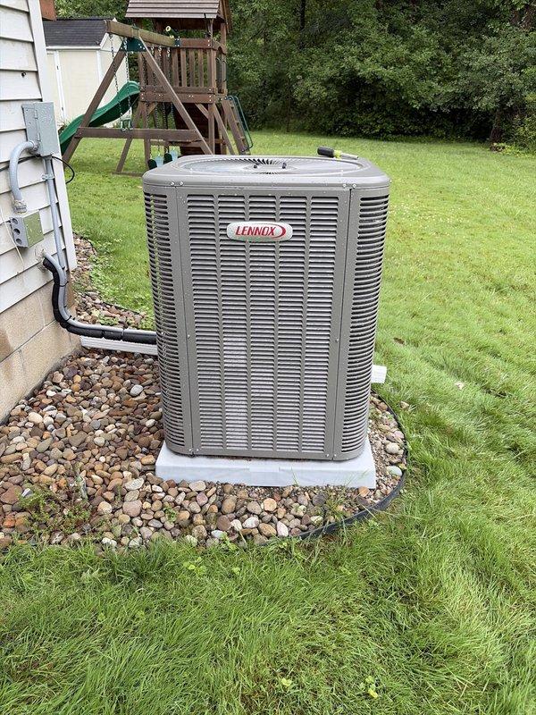 Completed annual preventive maintenance visit on residential Lennox air conditioning system. Performed comprehensive inspection of outdoor condenser unit, verified proper operation of all components, inspected indoor air handler grille and filtration system, and documented equipment condition with photographic records showing normal wear and minor dust accumulation on interior mesh screening.