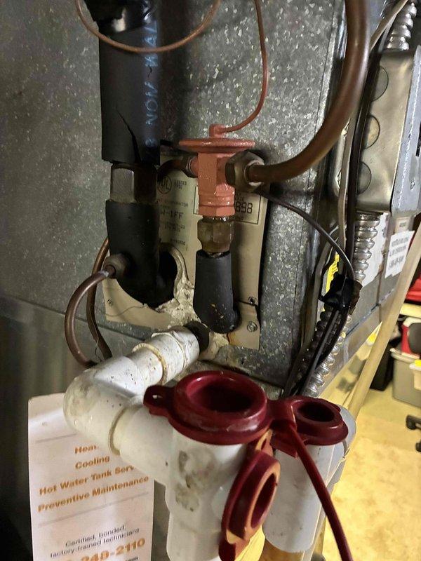 Completed routine HVAC cooling maintenance visit as part of ongoing preventive service program. Customer declined optional electrical inspection at time of service. System components were inspected and photographed, including water heating equipment with visible sediment buildup on filter housing and Honeywell controls, with ambient temperature reading of 70.5°F documented during visit.