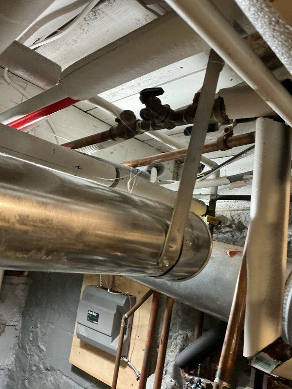 Conducted on-site assessment and provided estimate for replacement of 30-year-old boiler system that has failed and is no longer operational. Evaluated existing heating infrastructure including copper piping, manifold connections, and associated plumbing components in basement utility area. Documented current equipment configuration with water heater, expansion tank, and distribution system to ensure accurate replacement specifications and proper sizing for new boiler installation.