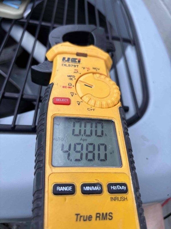 Completed routine cooling system maintenance on residential HVAC unit. Performed comprehensive inspection of air handler and associated components, verified electrical readings using digital multimeter, and tested capacitor functionality which measured 4980 microfarads. All equipment operating within normal parameters with no deficiencies noted.