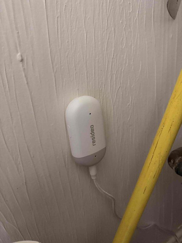 Completed installation and connection of water sensor and frost sensor to Resideo 8000 series thermostat system. Both sensors were properly wired and mounted in utility area near HVAC equipment and condensate drain lines to provide freeze protection and water leak detection monitoring.