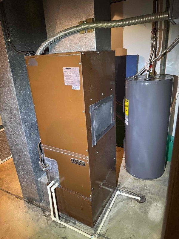 Responded to cooling system failure on 11-year-old heat pump with frozen copper refrigerant lines and evaporator coil. Upon arrival, confirmed ice buildup on suction line and indoor coil assembly. Diagnosed root cause as restricted airflow due to severely clogged air filter and dirty evaporator coil reducing heat exchange efficiency. Shut down system to allow complete ice thaw, replaced air filter, and cleaned evaporator coil. Verified proper airflow restoration, checked refrigerant charge levels, and confirmed system returned to normal cooling operation with no further freezing observed.