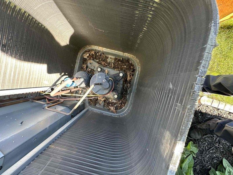 Completed preventative maintenance service on two residential air conditioning systems. Inspected both outdoor condensing units, clearing accumulated debris including leaves and organic material from around equipment and internal components. Evaluated and replaced worn electrical contactors on both units due to visible oxidation and deterioration of copper terminals, ensuring reliable system operation for the cooling season.