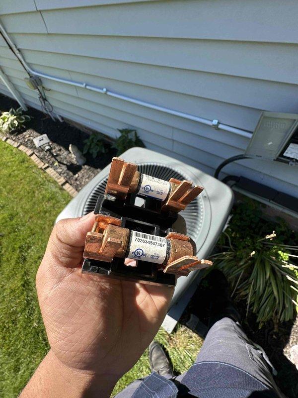 Completed preventative maintenance service on two residential air conditioning systems. Inspected both outdoor condensing units, clearing accumulated debris including leaves and organic material from around equipment and internal components. Evaluated and replaced worn electrical contactors on both units due to visible oxidation and deterioration of copper terminals, ensuring reliable system operation for the cooling season.