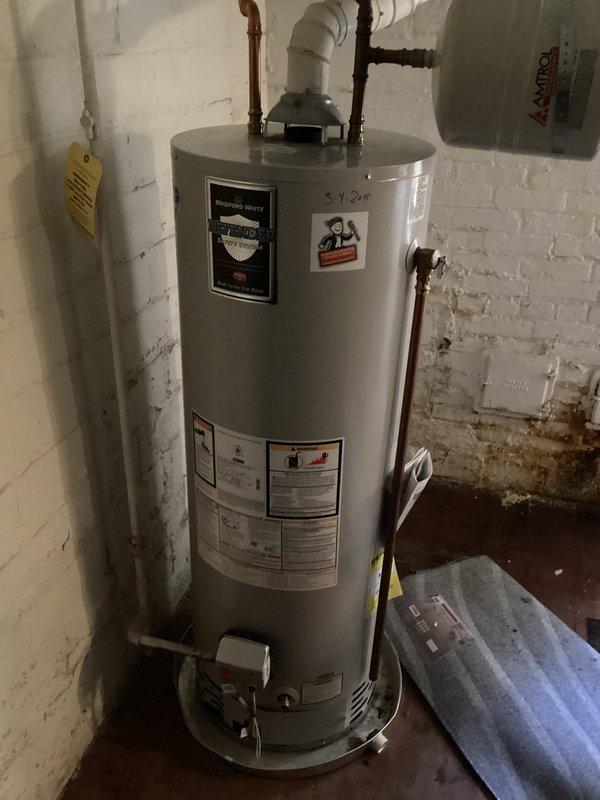 Completed scheduled plumbing maintenance visit for residential water heater system. Performed routine inspection of water heater unit, expansion tank, and associated plumbing connections including copper supply lines and PVC discharge piping. Verified proper operation of system components, checked for leaks or signs of deterioration, and documented current condition of equipment with photographic records. All components found to be functioning within normal parameters.