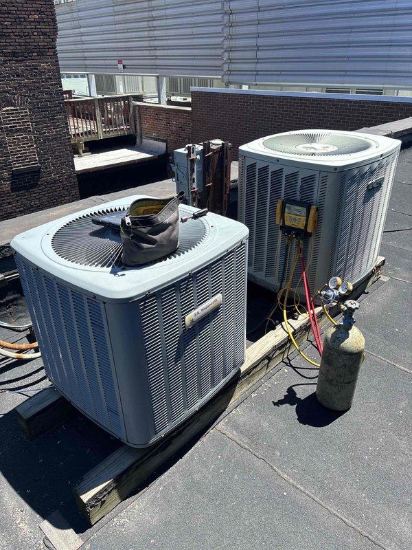 Performed two comprehensive leak searches on rooftop HVAC condensers. Connected manifold gauges to refrigerant system, conducted pressure testing, and inspected all refrigerant lines, coil connections, and internal components for leaks. Evidence of moisture exposure and corrosion observed in drain pan area during internal inspection.