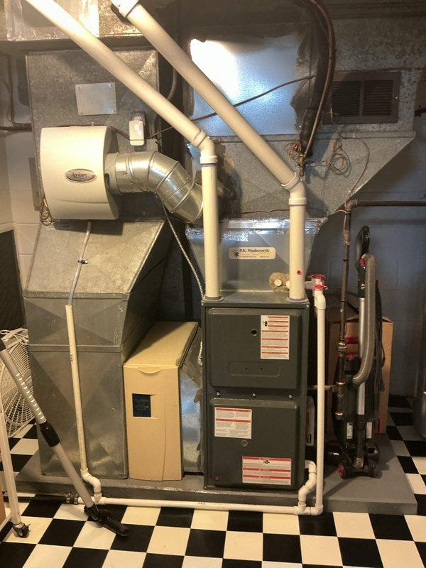 Completed comprehensive cooling maintenance on aging HVAC system in basement mechanical room. Performed standard preventive maintenance procedures including electrical current measurements using clamp meter, inspected furnace unit with connected Aprilaire humidifier, verified proper operation of PVC condensate drain lines, and examined copper refrigerant lines and ductwork components. All equipment found operational with routine maintenance tasks completed per manufacturer specifications for systems over 10 years old.