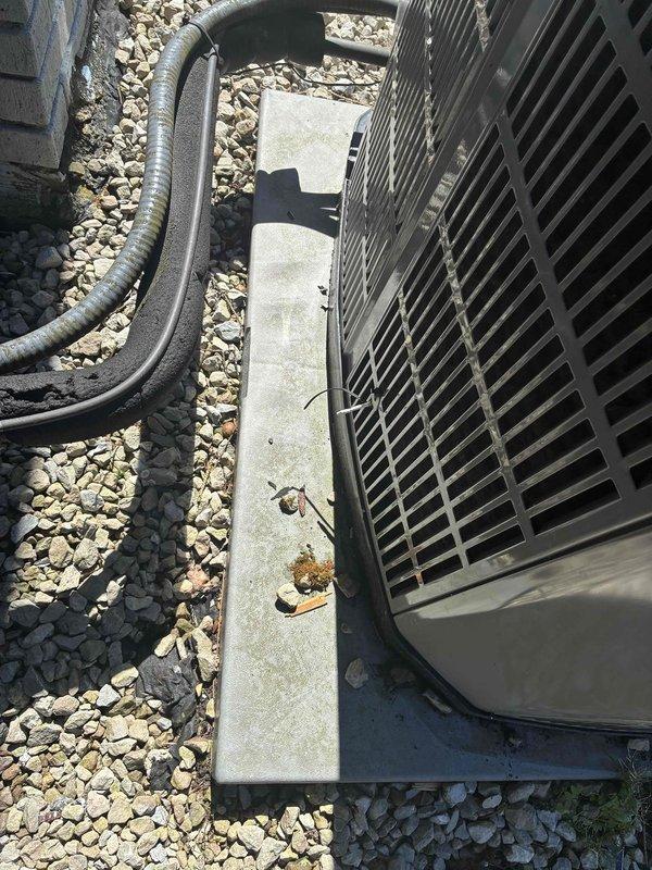 Responded to service call for hail-damaged American Standard Silver Series outdoor condensing unit requiring additional documentation for insurance claim. Conducted thorough visual inspection and photographed unit exterior, condenser coil fins, and installation area to provide evidence of hail impact damage to coil assembly that was previously identified by another technician but not documented. Captured detailed images showing unit condition, mounting configuration, and surrounding installation area to support insurance claim processing for unit replacement recommendation.