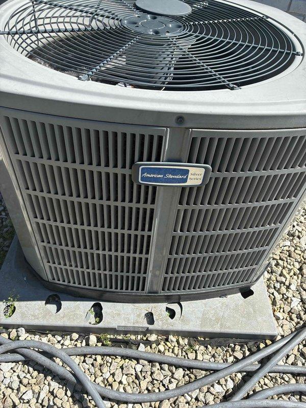 Responded to service call for hail-damaged American Standard Silver Series outdoor condensing unit requiring additional documentation for insurance claim. Conducted thorough visual inspection and photographed unit exterior, condenser coil fins, and installation area to provide evidence of hail impact damage to coil assembly that was previously identified by another technician but not documented. Captured detailed images showing unit condition, mounting configuration, and surrounding installation area to support insurance claim processing for unit replacement recommendation.