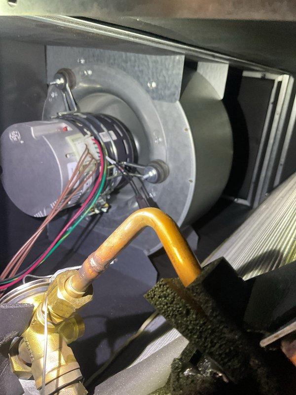 Completed scheduled cooling system maintenance as part of ongoing preventive maintenance program. Performed comprehensive inspection of air handler unit, including blower motor assembly, heat exchanger, and refrigerant lines. Documented significant rust and corrosion present on heat exchanger tubes and copper components, indicating advanced oxidation and equipment age. Verified blower motor operation and electrical connections. Inspected copper refrigerant piping and brass fittings for integrity. System operational at time of service completion, though heat exchanger corrosion noted for future monitoring and potential replacement consideration.