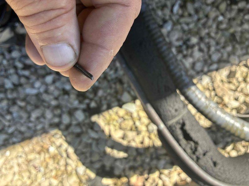 Returned to property to complete thermostat wire repair. Located and retrieved damaged wire section from exterior gravel area near foundation where conduit runs underground. Replaced faulty wire segment and secured new wiring through existing conduit pathway, ensuring proper connection and system functionality.