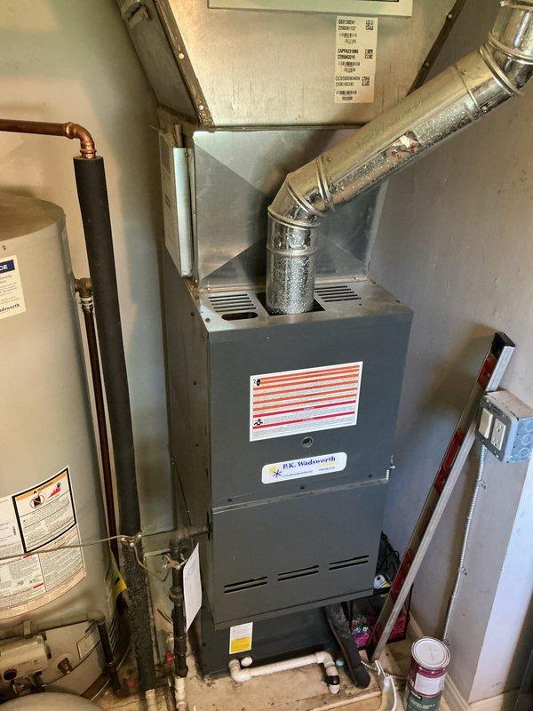Completed comprehensive cooling system tune-up on residential HVAC unit. Performed standard maintenance procedures including inspection of outdoor condenser coil with accumulated debris, verified refrigerant lines and electrical connections, and assessed indoor furnace/air handler system for proper operation. All components found to be functioning within normal parameters; system cleared for continued service.