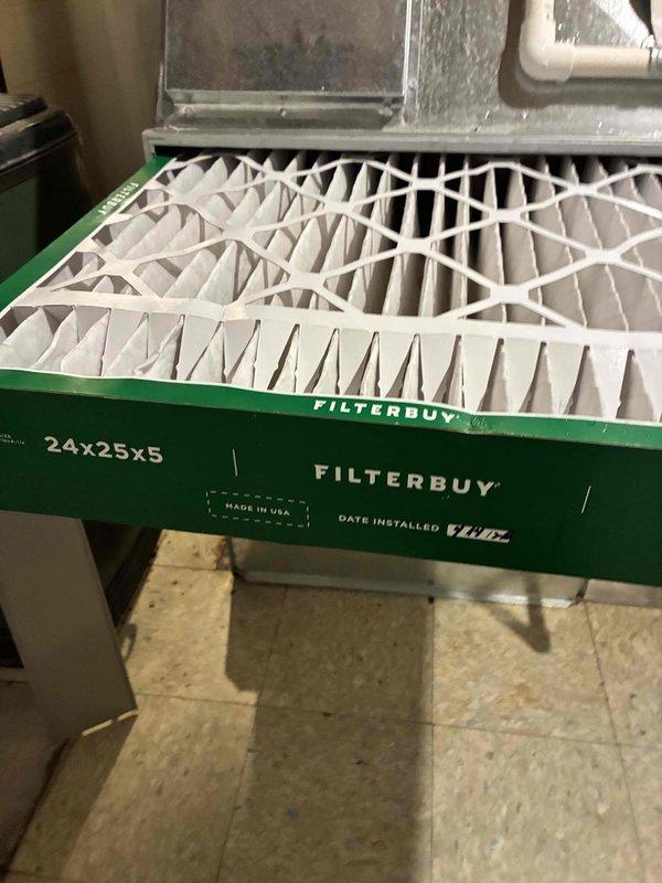 Completed scheduled cooling system maintenance visit. Inspected condenser coil assembly and documented fin condition with minor dust accumulation and discoloration along edges. Replaced 24x25x5 FILTERBUY air filter to maintain proper airflow and system efficiency.