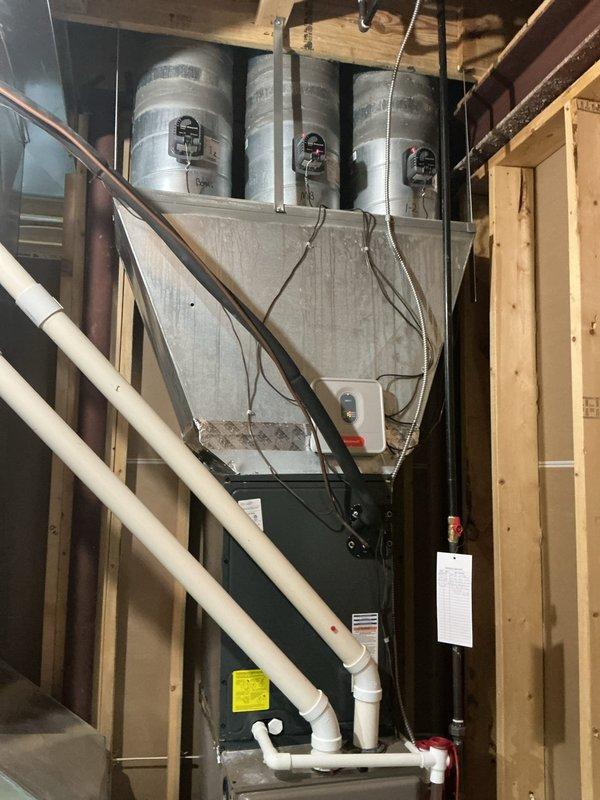 Completed scheduled preventive maintenance on two residential cooling systems as part of ongoing recurring service agreement. Performed comprehensive inspection and servicing of both HVAC units located in basement mechanical room, including air handling equipment and associated ductwork systems. 

Inspected primary cooling system with horizontal air handler configuration, verifying proper operation of all mechanical components, electrical connections, and control systems. Checked refrigerant levels, cleaned evaporator coils, and inspected condensate drainage system including PVC drain lines for proper flow and functionality. Verified all duct connections and sealed any potential air leaks in metallic ductwork.

Serviced secondary cooling system, performing identical maintenance protocol on furnace unit and associated cooling components. Cleaned or replaced air filters, inspected blower motor operation, and verified proper airflow throughout distribution system. Tested thermostat calibr