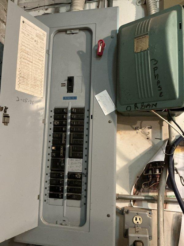 Conducted site assessment for commercial boiler system replacement in a four-story church facility. Inspected existing mechanical room infrastructure, documented electrical panel configuration with dual rows of circuit breakers and main disconnect, and evaluated current boiler piping system including aged cast iron valves, mixed PVC and copper piping assemblies, and shut-off valve locations to determine feasibility and scope of potential replacement project.