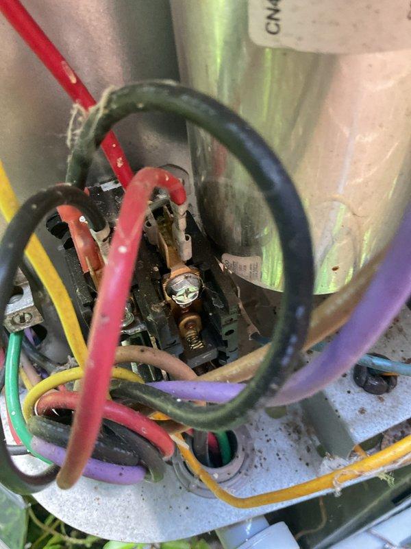 # HVAC Cooling Maintenance Completed

Performed comprehensive preventive maintenance on residential air conditioning system as part of ongoing seasonal maintenance program. Conducted thorough inspection of all electrical connections at terminal block, verifying proper wire terminations and secure connections across all control circuits including power, control, and communication wiring. Inspected blower motor assembly and heat exchanger components, noting normal operational dust accumulation on cylindrical housing. Verified all electrical wire connections within control panel showing secure terminations with appropriate color-coded conductors properly installed. All system components inspected and found operational with no immediate repairs required. Unit ready for continued cooling season operation.