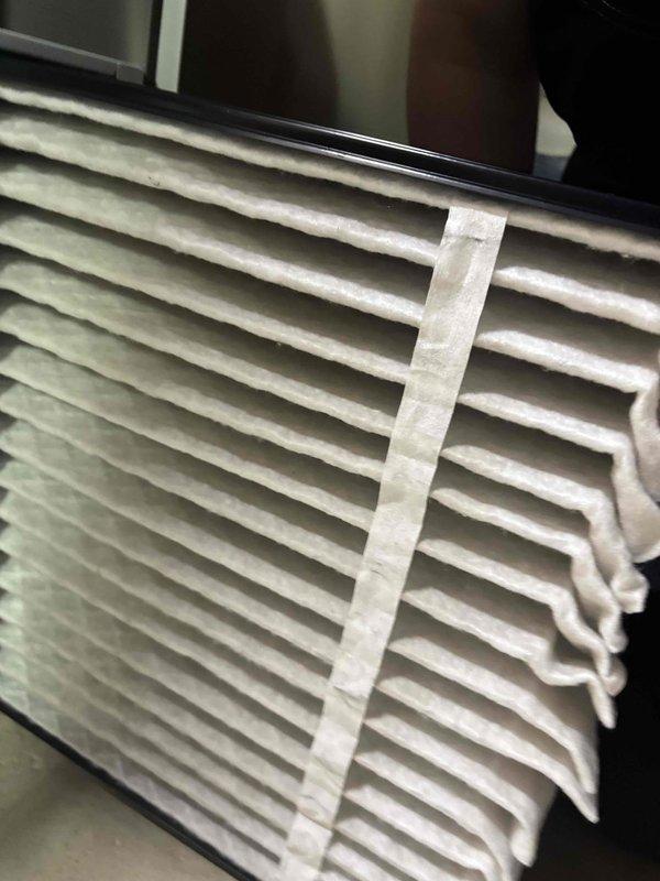 Completed seasonal preventative maintenance on a one-year-old residential air conditioning system with no reported issues. Performed comprehensive system inspection including electrical testing with digital multimeter to verify proper voltage and amperage readings at all components. Measured and inspected air filter for proper sizing and condition, documenting dimensions to ensure correct replacement specifications for future service intervals.