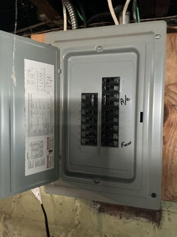Conducted comprehensive assessment of 22-year-old HVAC system installed in 2004 to provide full system replacement options. Evaluated existing equipment accessibility in basement mechanical space, documenting electrical panel configuration and plumbing infrastructure for replacement planning. Photographed current installation conditions including circuit breaker panel, exposed PVC drain lines, and mechanical room layout to support accurate equipment sizing and installation specifications for customer's replacement estimate.
