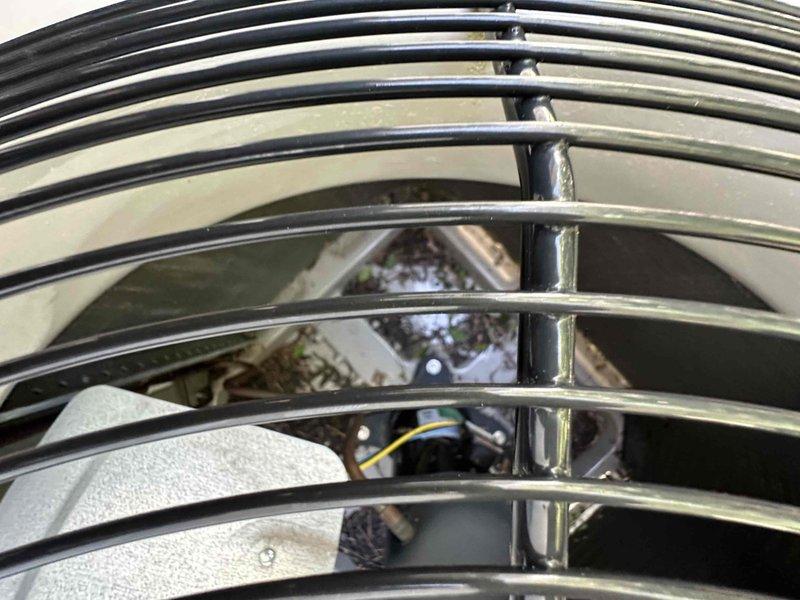 Completed routine HVAC cooling maintenance on residential outdoor condenser unit. Performed standard inspection and maintenance procedures, noting that electrical service had been previously completed. Unit operational with visible weathering and debris accumulation on exterior grille requiring attention during service.