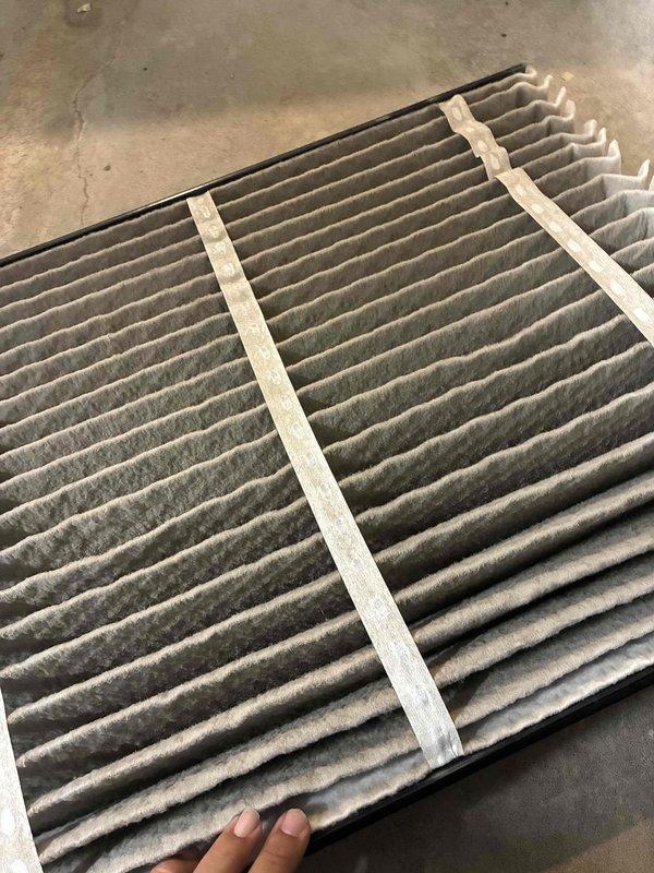 Completed comprehensive heating and cooling tune-up on HVAC system. Performed internal inspection of furnace cabinet, examining burner assembly, heat exchanger components, electrical connections, and wiring harnesses—all components found in serviceable condition. Replaced heavily soiled air filter with significant dust and debris accumulation to restore proper airflow and system efficiency.