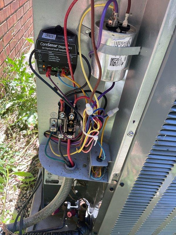 # HVAC Cooling System Maintenance

Performed comprehensive cooling maintenance on residential split system with Amana furnace and outdoor condensing unit. Conducted electrical diagnostics using CoreSense testing equipment to evaluate capacitor performance, contactor operation, and electrical connections throughout the system. All electrical components tested within normal operating parameters. Inspected indoor air handler blower assembly and verified proper operation. Outdoor unit access panel removed for thorough inspection of electrical components, capacitor, and contactor. All wire connections checked and secured. System operational and functioning as designed upon completion of maintenance procedures.