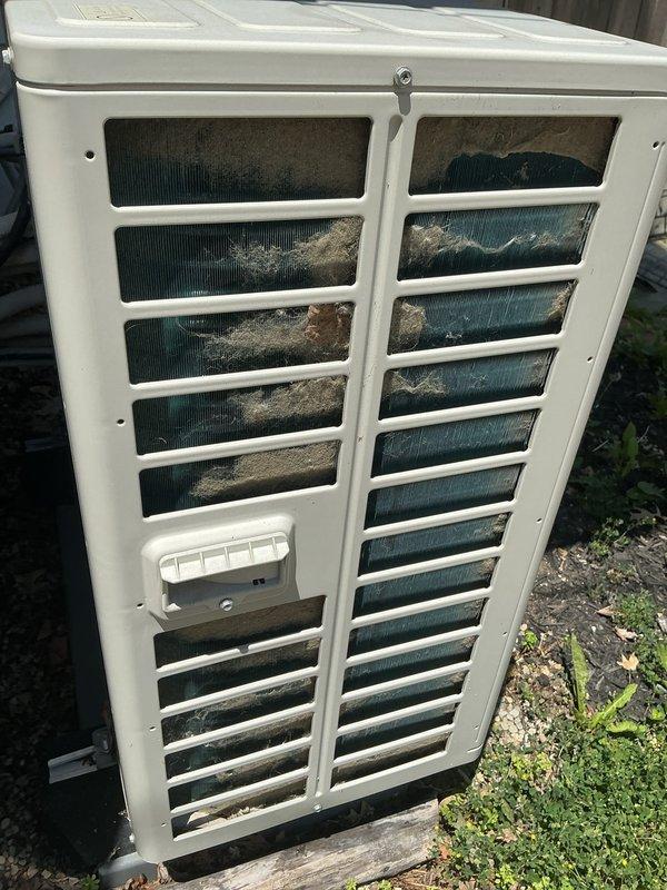 Performed routine cooling maintenance on outdoor condensing unit. Inspected condenser coil and found significant accumulation of dust, lint, and debris blocking airflow through the fins and ventilation grilles. Cleaned condenser coil and exterior surfaces to restore proper airflow and system efficiency.