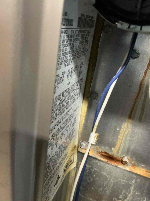 Conducted comprehensive assessment of existing Luxaire furnace and complete HVAC system in basement mechanical room to provide full system replacement options. Documented current equipment conditions including manufacturer specifications, electrical connections, and visible corrosion on metal components and ductwork, noting easy access to installation area for future replacement work.