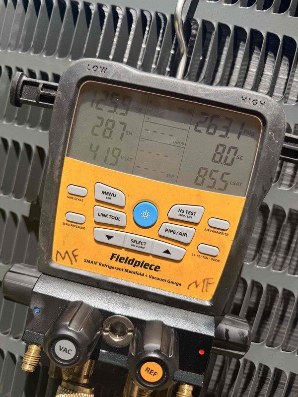 Completed installation of new Goodman air conditioning system. Installed outdoor condensing unit on concrete pad with proper electrical disconnect and conduit routing, then installed evaporator coil and performed system evacuation and refrigerant charging procedures, verifying proper operating temperatures and pressures with digital manifold gauges to ensure optimal system performance.