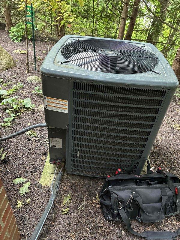 Completed scheduled preventive maintenance on residential air conditioning system. Performed outdoor condenser unit inspection, verified refrigerant levels at service ports, and conducted indoor air handler maintenance including condensate drain line servicing using funnel attachment for proper system operation.