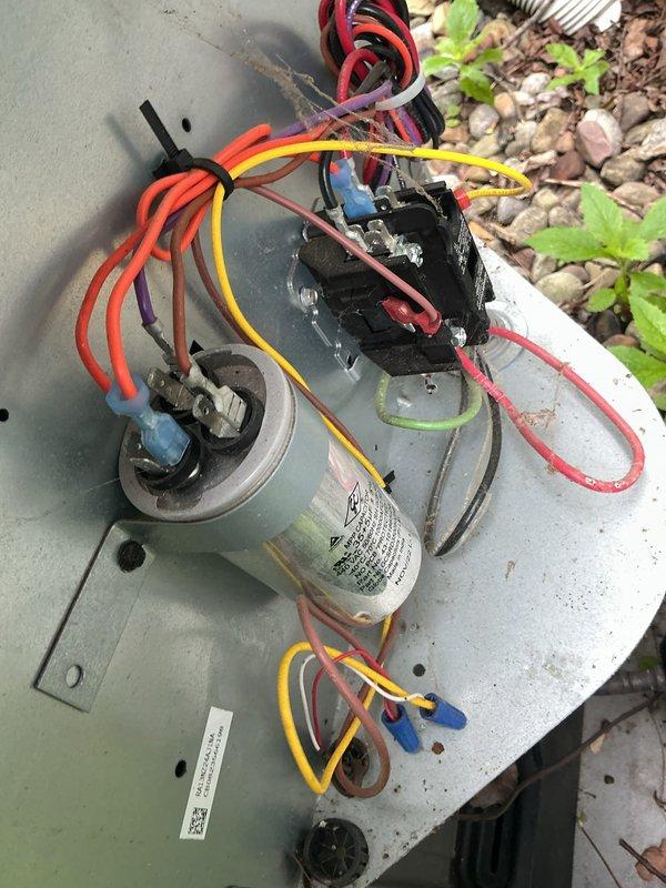 # HVAC Cooling System Maintenance

Performed comprehensive preventive maintenance on outdoor air conditioning unit. Conducted thorough inspection of condenser fan assembly, verifying proper operation of fan motor and blade configuration. Examined protective wire guard for structural integrity and secure mounting. Assessed electrical components including capacitor and contactor relay, checking all wire connections and terminals for proper contact and signs of wear. Verified capacitor specifications and tested electrical connections across multiple circuits. Inspected unit housing for weathering damage and confirmed adequate clearance from surrounding vegetation. System operational and functioning within normal parameters upon completion of maintenance service.