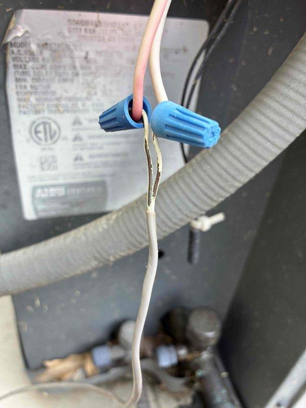 Completed comprehensive cooling system tune-up and performance evaluation. Verified electrical connections at equipment junction, inspected wire terminations with proper wire nut installations, and performed voltage testing using calibrated digital multimeter to ensure system operating within manufacturer specifications at 44.29 volts for control circuit. All components found functioning properly with no deficiencies noted.