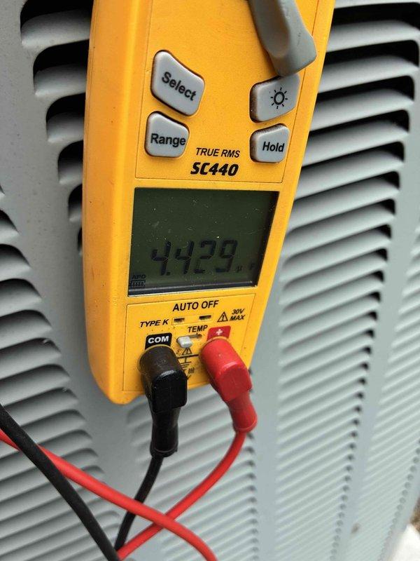 Completed comprehensive cooling system tune-up and performance evaluation. Verified electrical connections at equipment junction, inspected wire terminations with proper wire nut installations, and performed voltage testing using calibrated digital multimeter to ensure system operating within manufacturer specifications at 44.29 volts for control circuit. All components found functioning properly with no deficiencies noted.