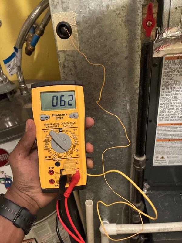 Completed installation of new Goodman air conditioning condenser unit on exterior concrete pad with proper electrical conduit connection and refrigerant line routing. Performed system diagnostics and electrical testing using calibrated multimeter to verify proper voltage readings and confirm all components operating within manufacturer specifications.