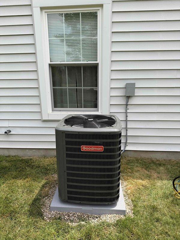 Completed installation of new Goodman air conditioning condenser unit on exterior concrete pad with proper electrical conduit connection and refrigerant line routing. Performed system diagnostics and electrical testing using calibrated multimeter to verify proper voltage readings and confirm all components operating within manufacturer specifications.