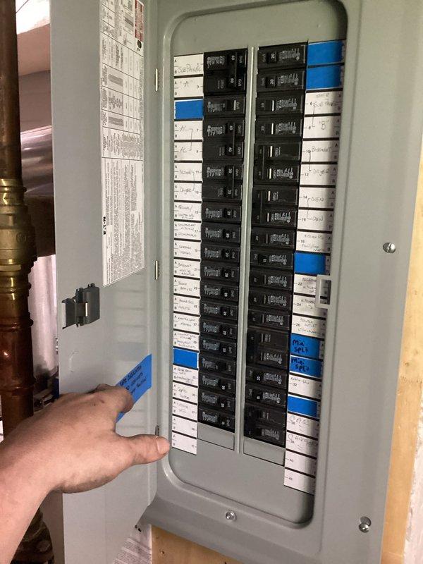 Installed new 15-amp electrical circuit with associated wiring and conduit routing. Work included modifications to the main electrical panel with proper breaker installation and labeling, exterior disconnect box integration, and professional conduit installation along the building exterior using gray electrical conduit with appropriate mounting brackets and connections to existing PVC conduit system.