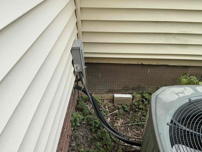 Provided comprehensive HVAC system replacement estimate for small residential cooling system serving 0-1500 square feet with basement unit location. Presented three tiered Goodman air conditioning and coil replacement options with varying efficiency levels: Good tier at up to 13.4 SEER, Better tier at up to 14 SEER, and Best tier at up to 16 SEER. Evaluated existing outdoor condensing unit showing significant age-related deterioration, weathering, and discoloration on exterior casing. Assessed installation site conditions including accessible mounting location against exterior wall with adequate clearance, existing electrical disconnect box and refrigerant line routing, and surrounding landscape considerations for equipment placement and service access.