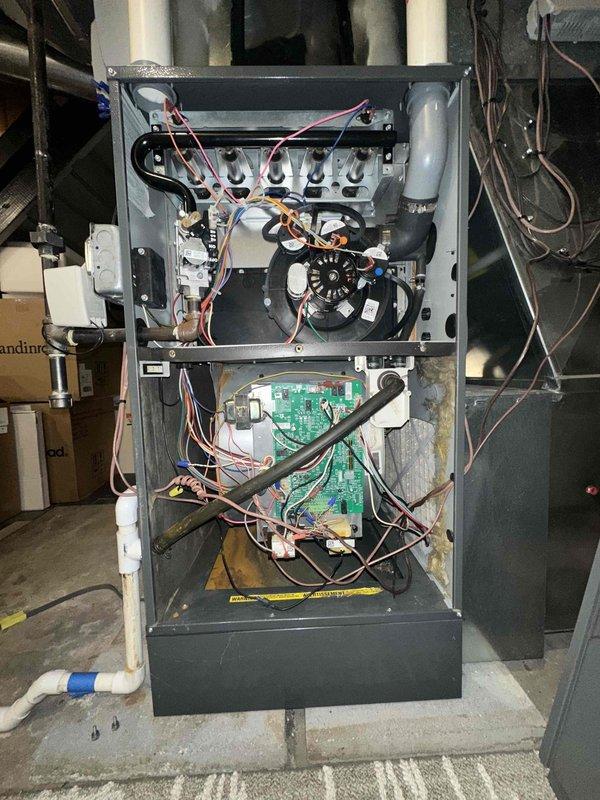 # HVAC Maintenance - Cooling System Service

Performed comprehensive annual AC tune-up and preventive maintenance on residential cooling system as part of membership plan. Upon arrival, homeowner reported no operational issues or concerns with system performance.

Conducted thorough visual inspection of outdoor condensing unit, checking for physical damage, debris accumulation, and proper clearances. Verified refrigerant line insulation integrity and checked for signs of refrigerant leaks at service ports and connection points. Inspected electrical disconnect and contactor operation.

Proceeded to indoor air handler and furnace system for complete evaluation. Removed furnace access panels to access internal components. Inspected gas valve assembly, heat exchanger, and burner compartment for proper condition. Examined blower motor assembly and verified operational status of fan components.

Evaluated control board and electrical connections throughout system. Checked all wire terminatio